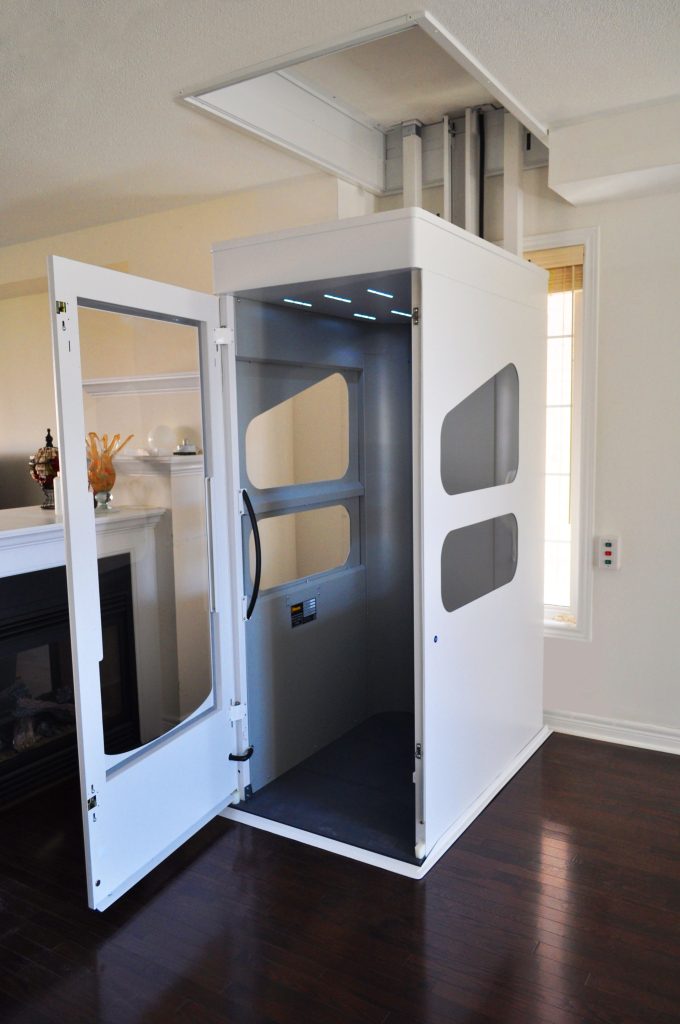 Interior view of a Wessex VE fully enclosed through-floor home lift with the door open, showing a spacious cabin designed for wheelchair users and everyday home access.