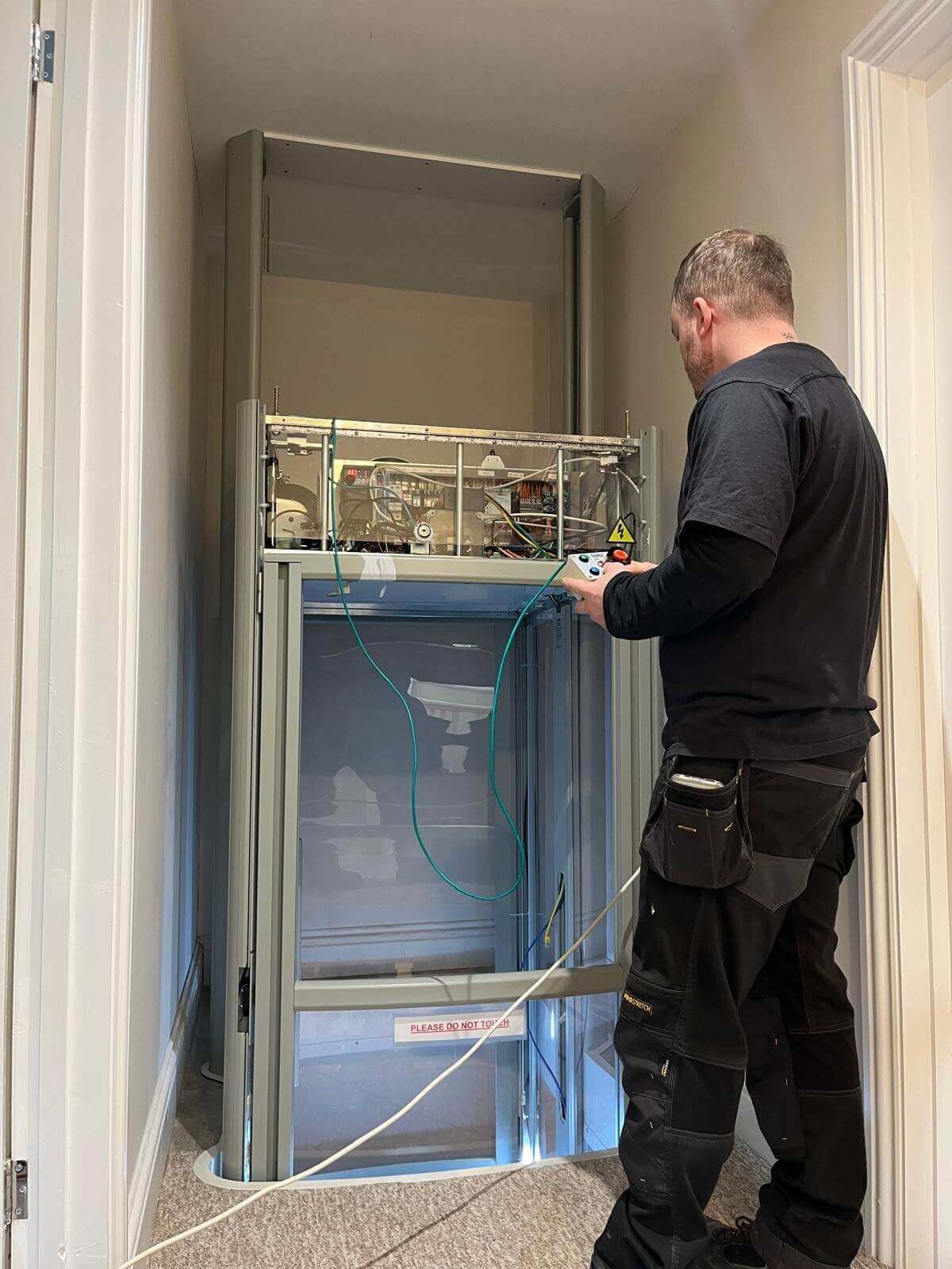 1st Choice Homelifts engineer installing a Stiltz Through-The-Floor home lift