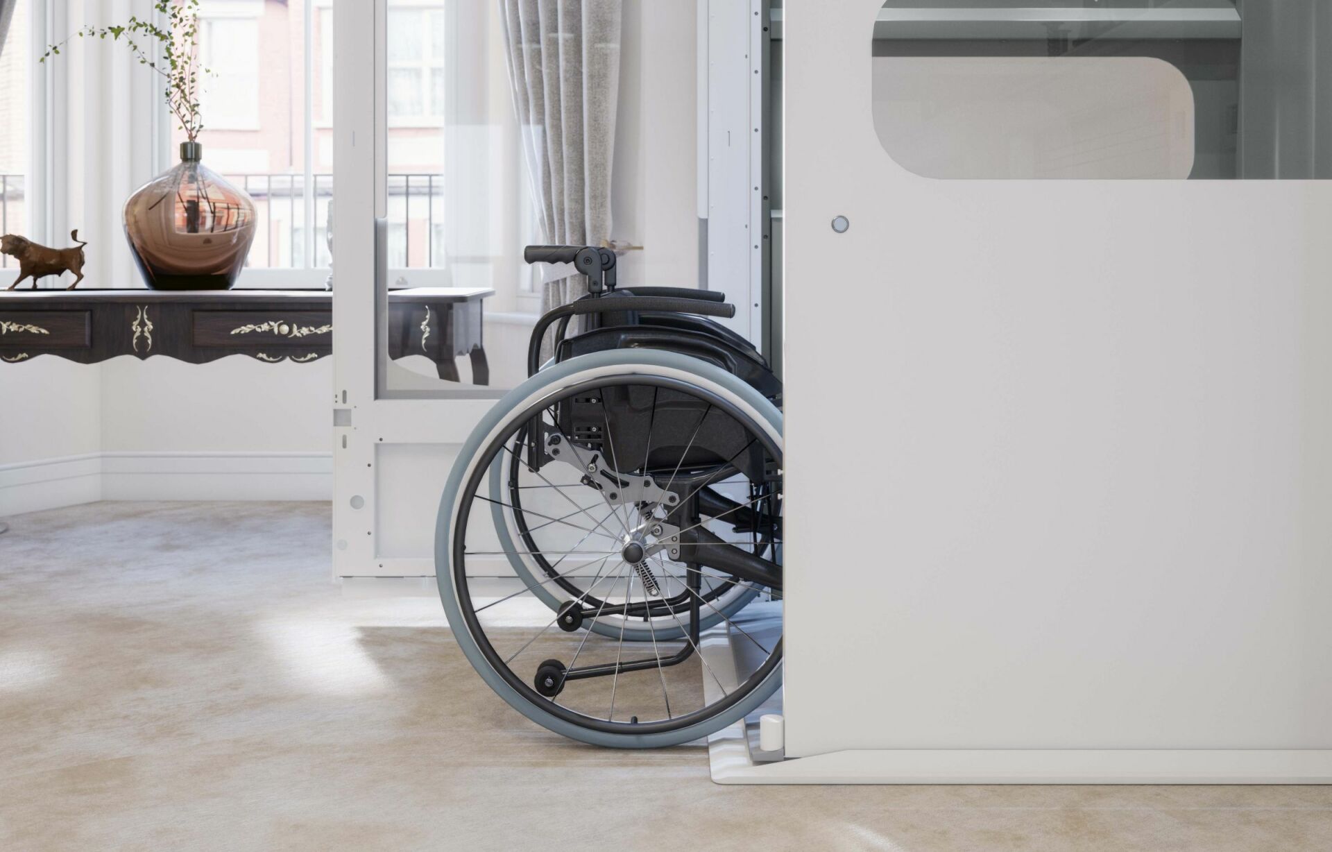 Home lifts for wheelchair users with lift in a downstairs lounge